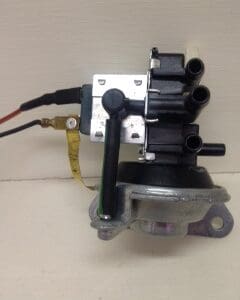 A car ignition switch with wires attached to it.