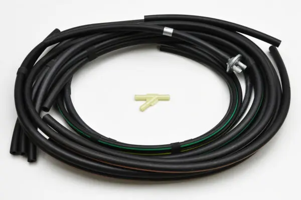 A black hose with a yellow end and a green piece of wire.