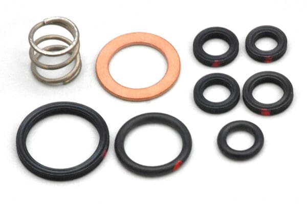 A group of different types of rubber and metal parts.