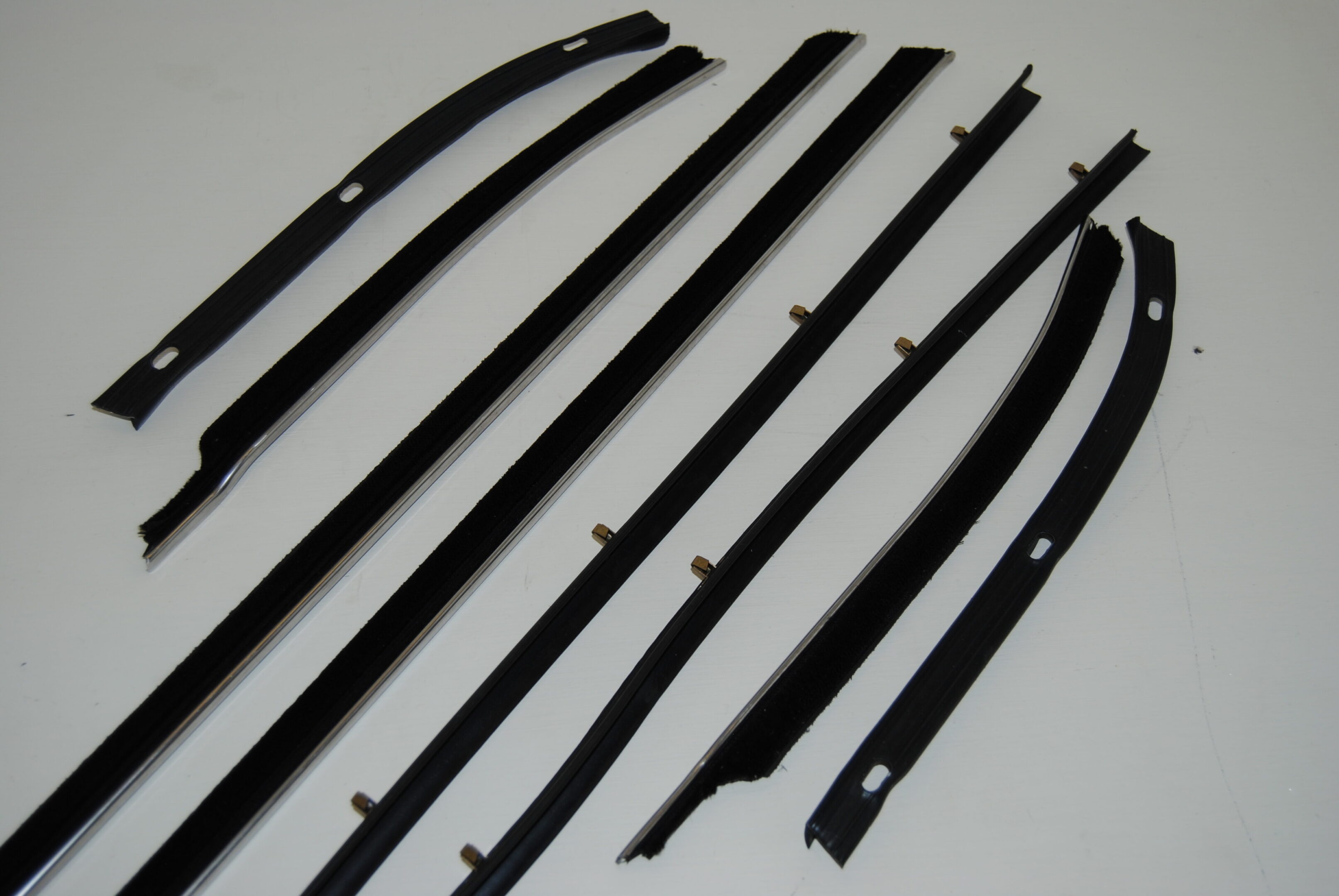 A set of eight pieces of black plastic.