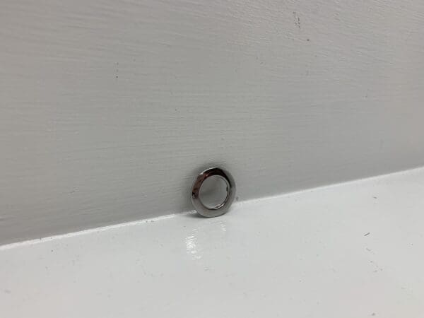 A close up of a ring on the wall