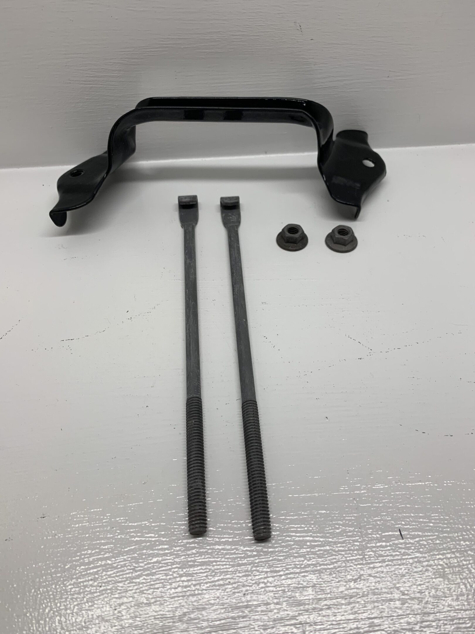 A black handle and two long metal sticks.