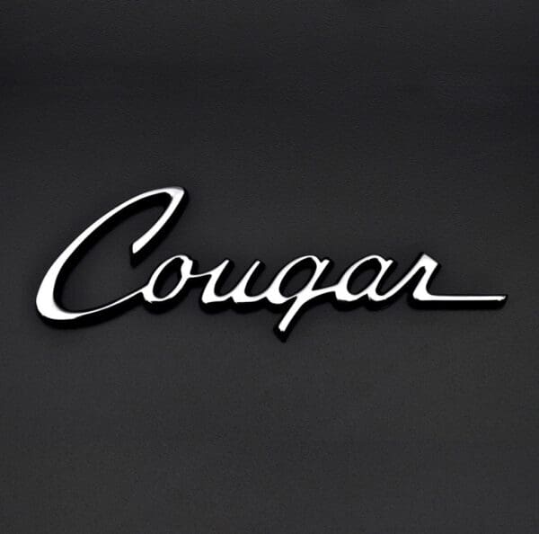 A black wall with the word cougar written in it.