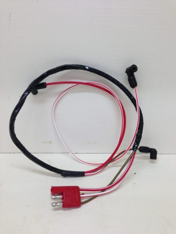 A wire harness with red and black wires.