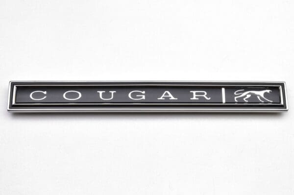 A close up of the word cougar on a pen