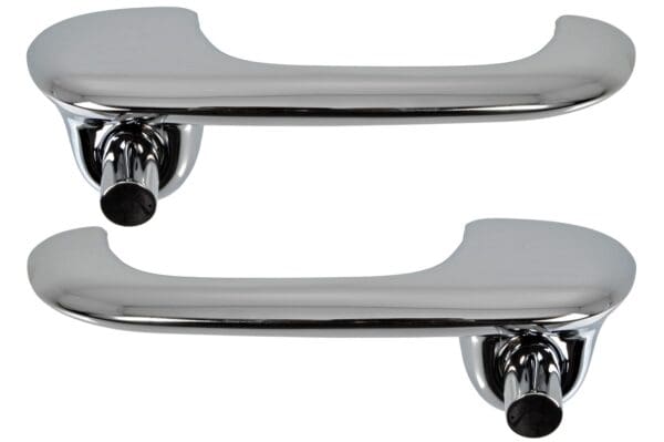 A pair of chrome handles with black knobs.