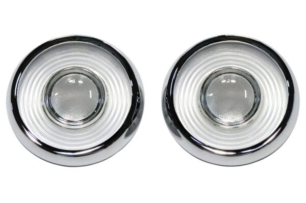 A pair of chrome knobs with clear glass inserts.