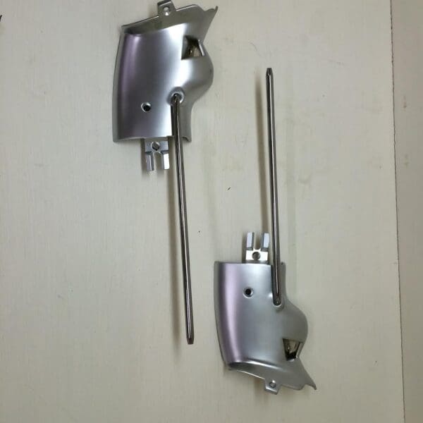 A pair of metal hooks hanging on the wall.