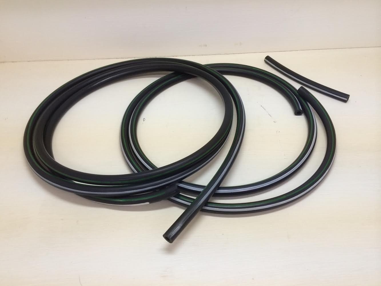 A pair of black plastic tubing sitting on top of a table.