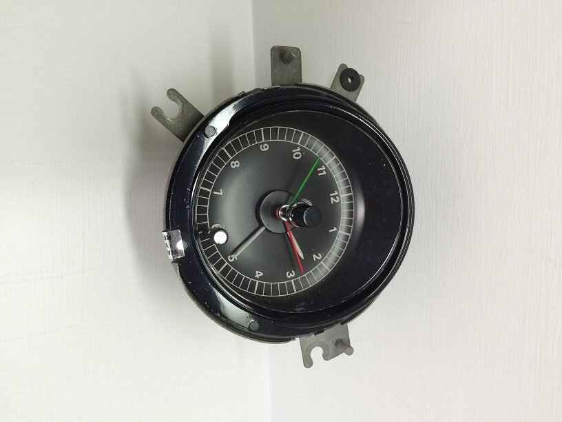 A black and white clock on the wall