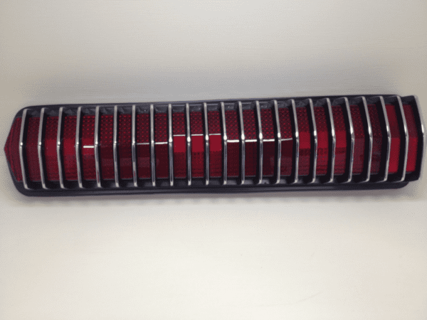 A red and black tube on top of a white table.