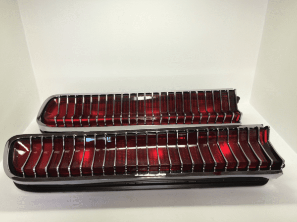 A pair of red and chrome car lights.