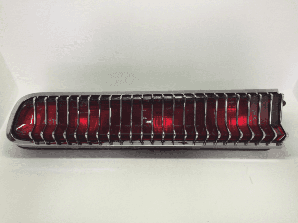 A red light is on in the middle of a white background.