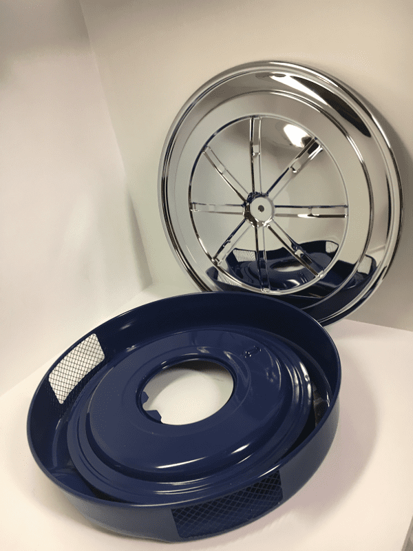 A blue and silver wheel sitting on top of a white table.