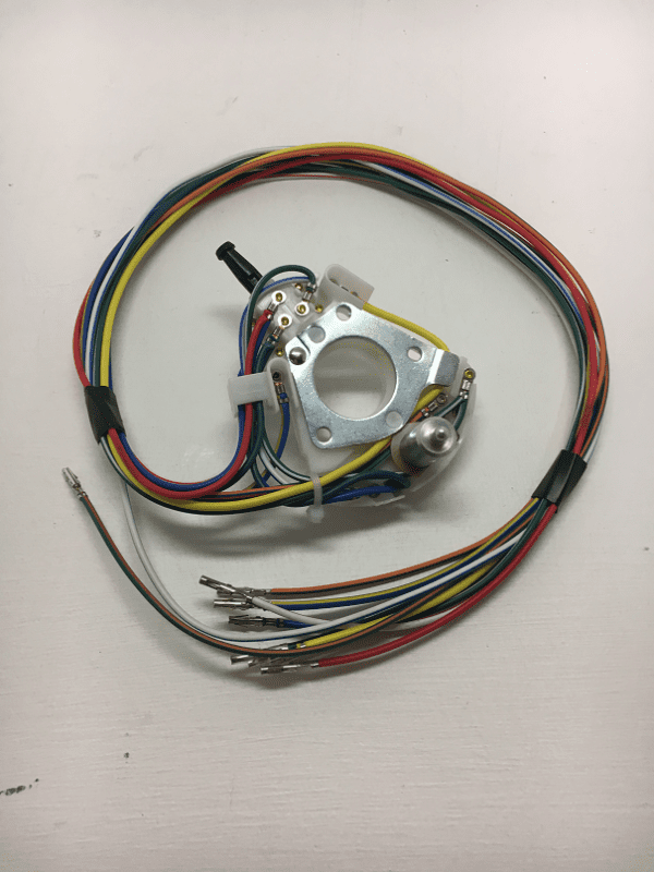 A wire harness with wires and an electrical device.