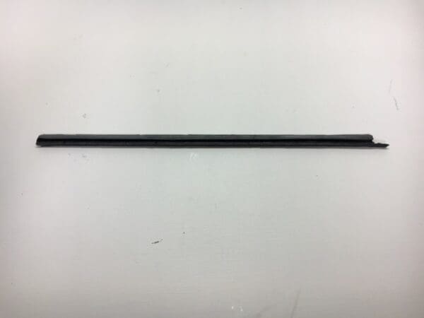 A black rod is bent to the side.