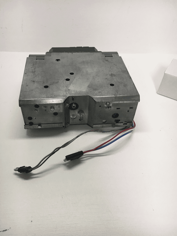 A metal box with wires attached to it.