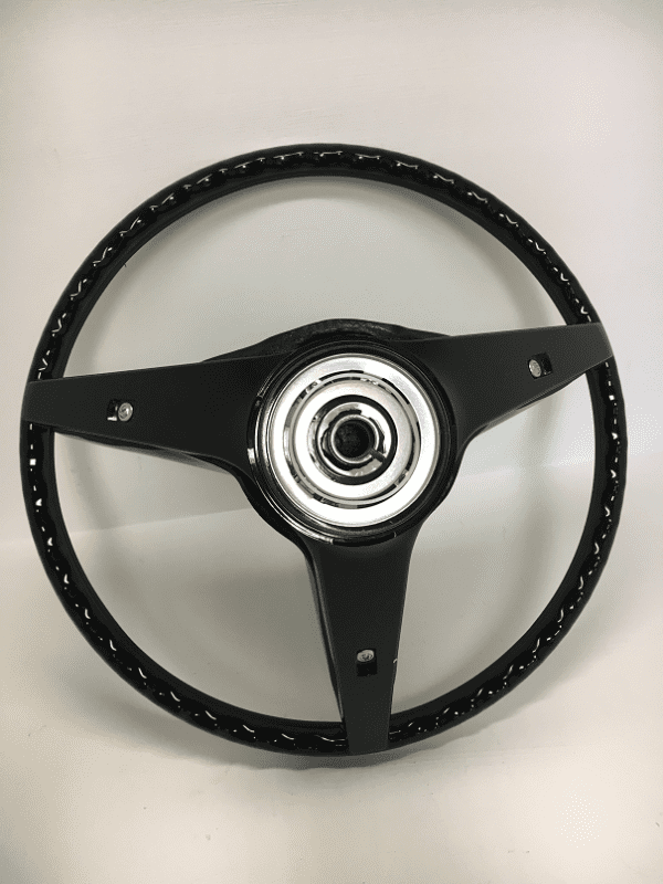 A steering wheel with black and silver trim.