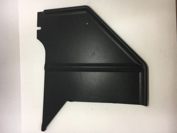 A black plastic piece of material on top of a table.