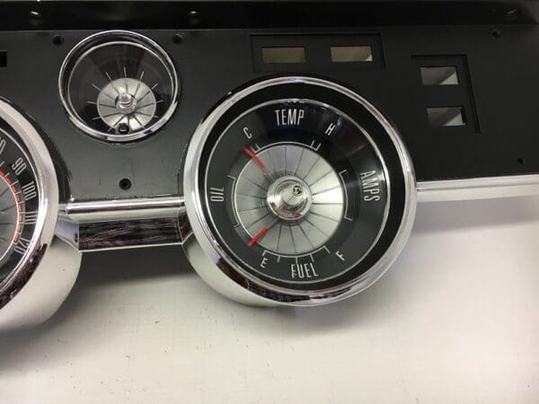 A close up of the clock on a dashboard