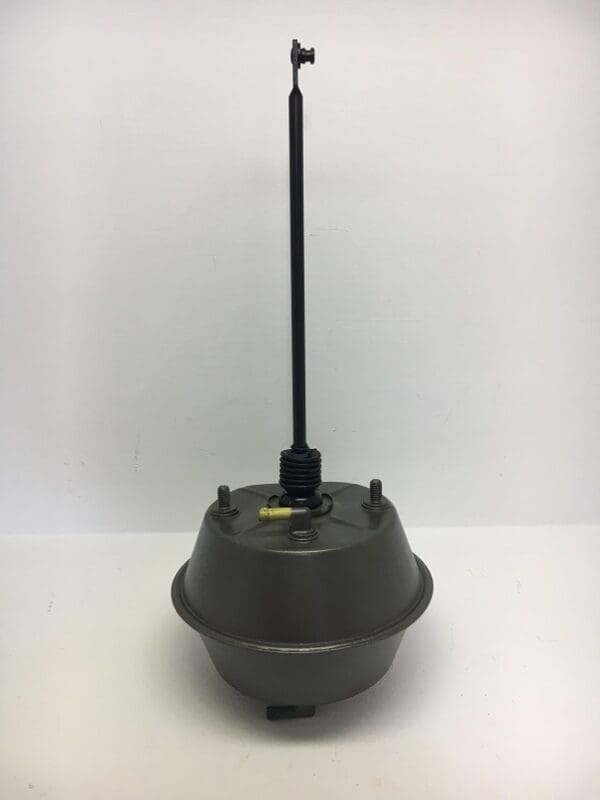 A green device with a black antenna on top.