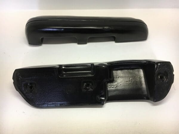 A black plastic handle and the bottom of it