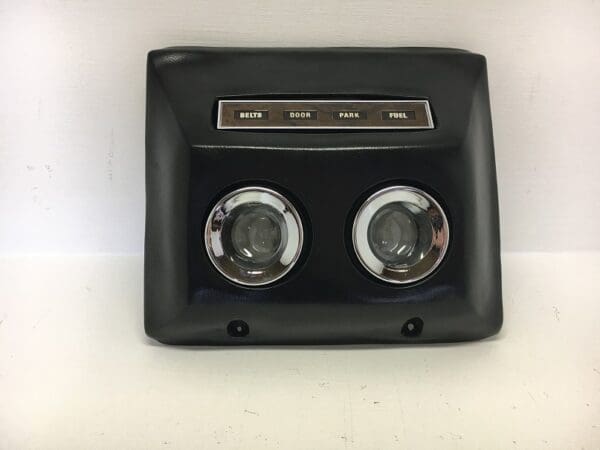 A black and silver car dash clock