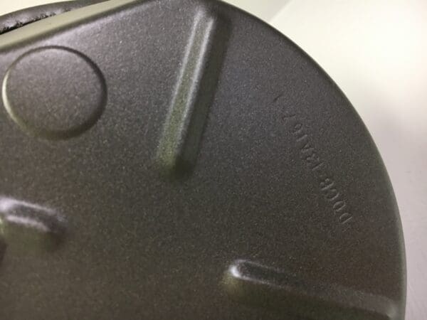 A close up of the bottom of an iron pan.