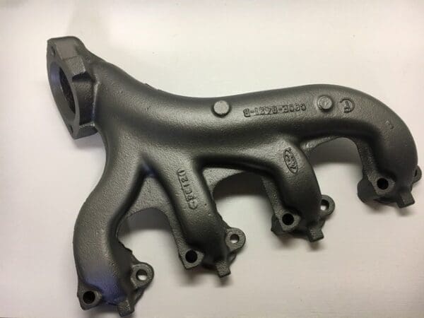 A close up of the exhaust manifold on a car