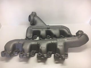 A pair of old cast iron exhaust manifolds.