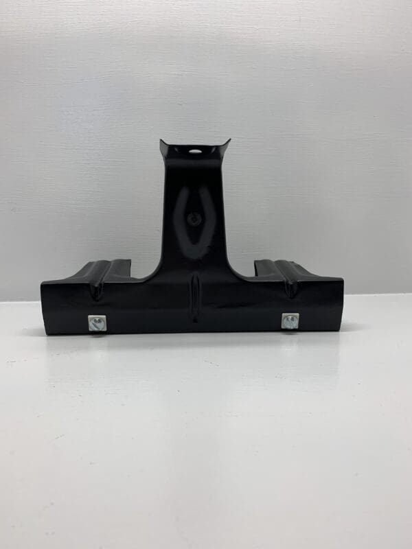 A black plastic holder sitting on top of a table.