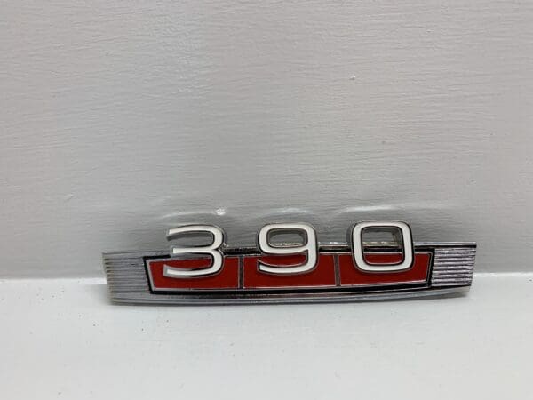 A close up of the number 3 9 0 on a car