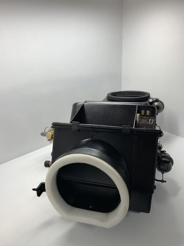 A black camera with white ring on the side of it.