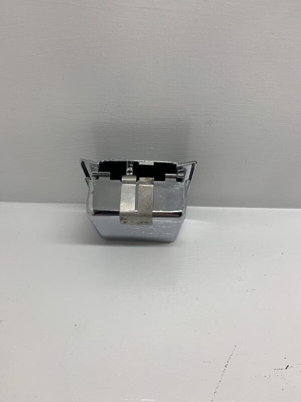 A silver container sitting on top of a table.