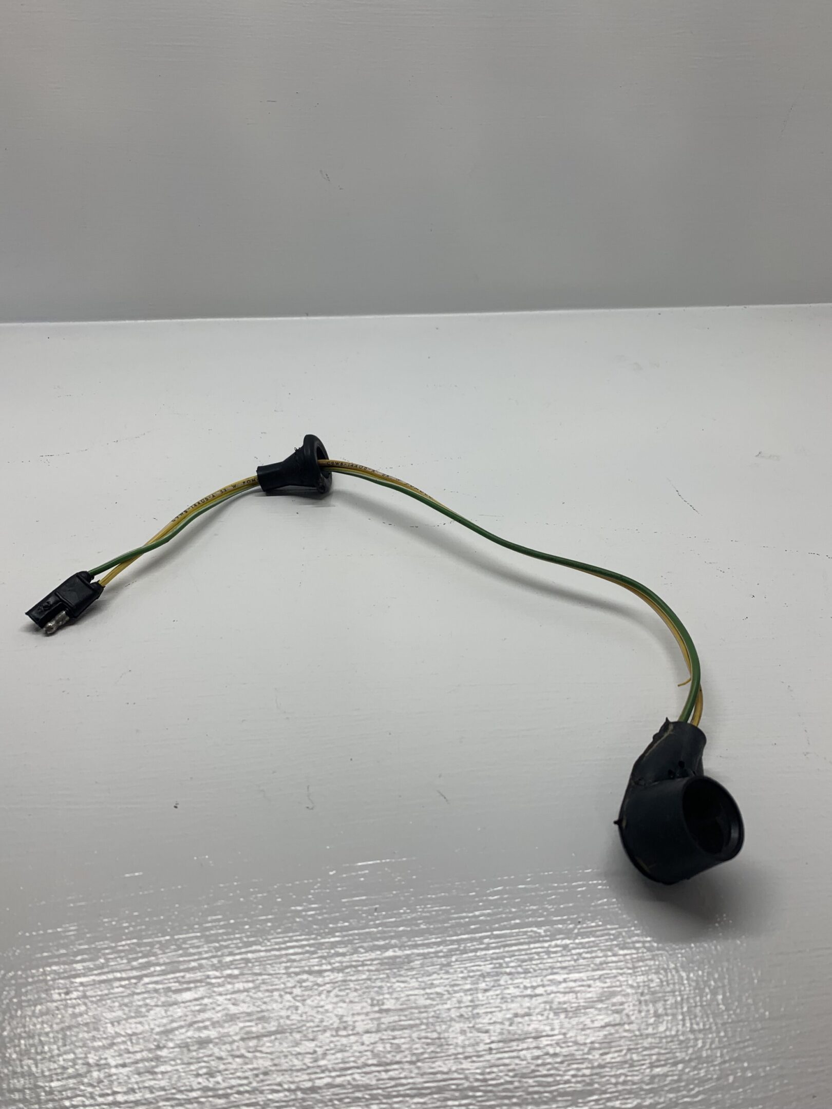 A black cord with two wires attached to it.