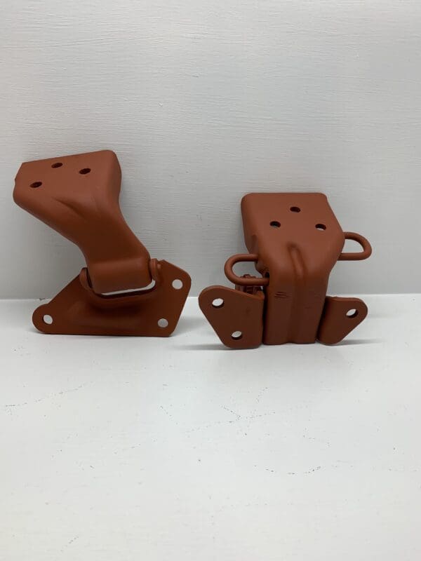 A pair of brown plastic handles sitting on top of a table.