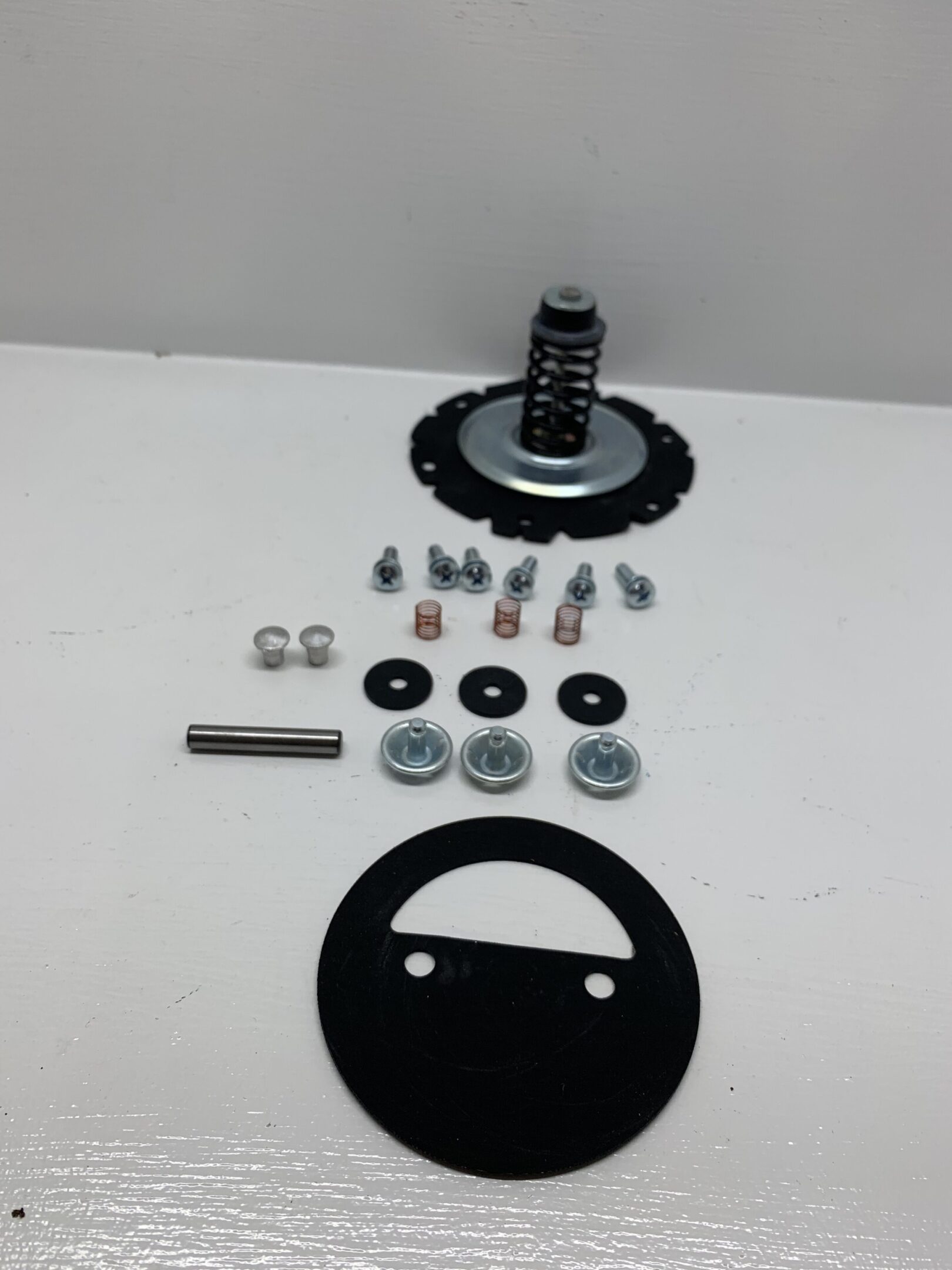 A picture of some parts that are needed to make a homemade air compressor.